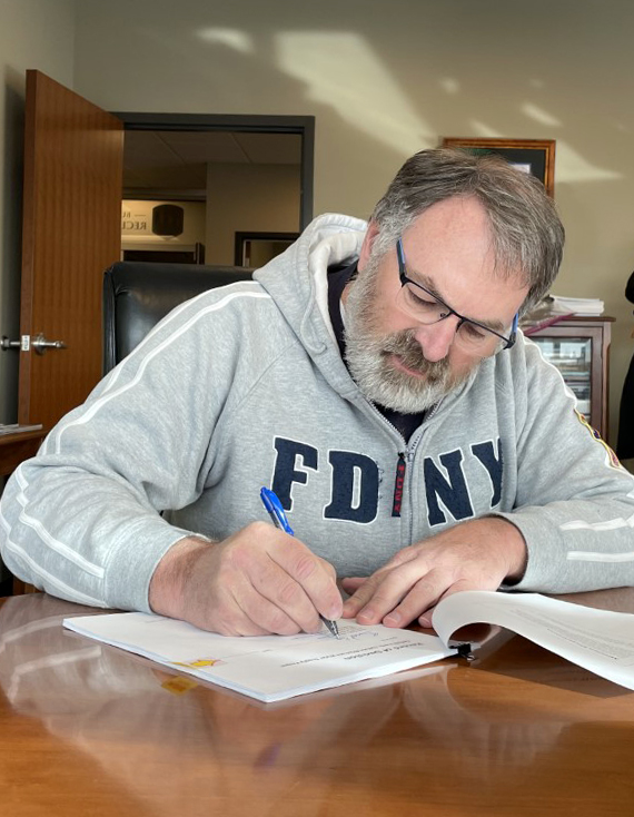 Brent Esplin, Missouri Basin and Arkansas-Rio Grande-Texas Gulf Regional Director, signs the Record of Decision for the ENDAWS project.
