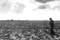 Early image of Bureau photographer taking photos on the plains