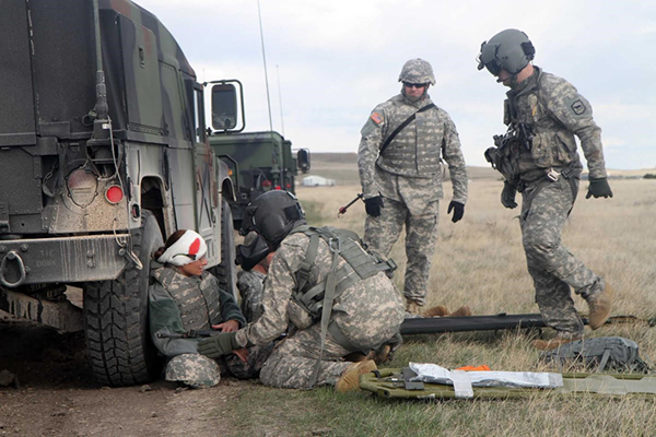 Soldiers patrolled in Humvees on the Fruitdale access road and encountered a grenade simulator and a smoke grenade in a burn barrel. Soldiers were injured and laying along the road. Unharmed soldiers dismounted Humvees, provided security and called in Air-Medivac. A UH60 helicopter landed and medivac injured soldiers. Soldiers used blank ammunition to aid in the realism of the training activity. All blank ammunition was fired from vehicles on the road or from soldiers on foot near or on road.