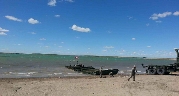 Soldiers from the 200th Engineer Division conducting Dry Span Bridging and Improved Ribbon Bridge training activities on Reclamation lands at Belle Fourche Reservoir as part of the 2017 Golden Coyote Exercise.