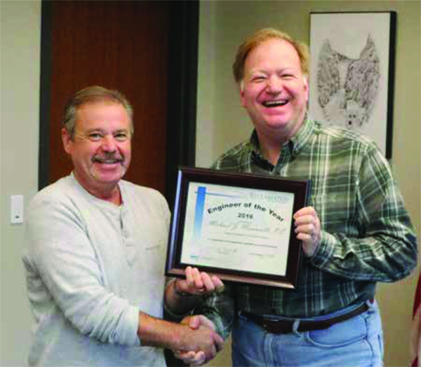 Michael Maroncelli receives the Great Plains Region Engineer of the Year award from Regional Director Mike Ryan.