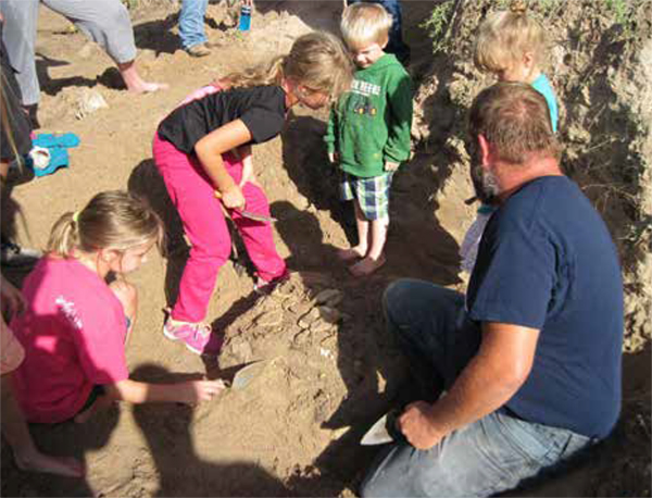Kids assist with paleontological recovery near  Medicine Creek Reservoir, Nebraska.