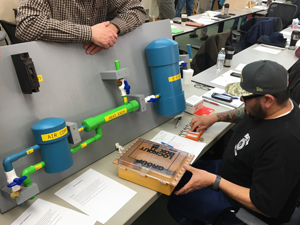 Ronnie Rogers, Flatiron Plant Mechanic, prepares a switching program form and gets ready to apply locks.