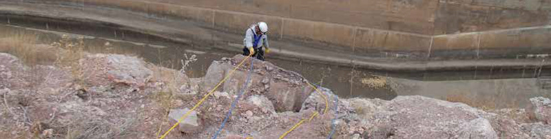 Mark Neely roping down a slab above Guernsey North Spillway.