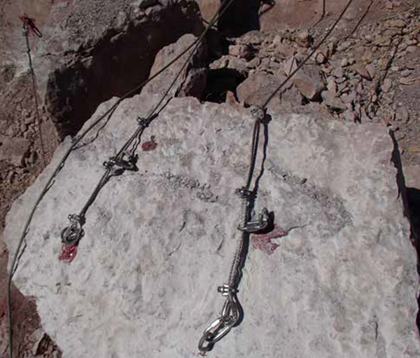 Rock slab over the spillway with epoxy grouted anchors.
