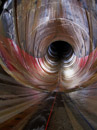 Looking down the Yellowtail Dam spillway tunnel from above the air slot. The seepage from the drains creates an interesting array of colors. Photo by Joe Rohde.