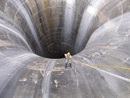 Brian Hollis rappels into Gibson Dam glory hole spillway. Photo by Joe Rohde