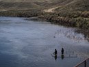 Utilizing a flooded, handicap accessible fishing pier on the North Platte River below Pathfinder Dam by Brad Cannon.