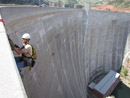 Dave Tordonato (TSC) and Patrick Fischer (GPRO) inspect the downstream side of Yellowtail Dam. Photo by Jeff Ticknor.