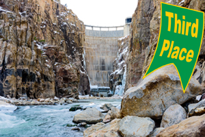 Third Place Winner: A photo of Buffalo Bill Dam in Cody, Wyo. This was taken on a frigid February day in 2017. We had just moved to Cody and my husband wanted to show me the view of his new workplace from the bottom. After a walk up the dam access road, I stood in freezing water (in muck boots), leaning on a boulder to capture this shot. The icy waters match the icicles that had formed along the edges of the dam. The granite was wet with recent snow melt and ice still clung to rocks in the Shoshone River.