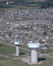 The three million gallon composite 85th Street water tower (at the southern Edge of Sioux Falls) under construction. Southern Sioux Falls is shown behind the Lincoln County Rural Water System tower and the larger Lewis and Clark Rural Water System 85th Street tower in December 2011.