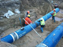 Inspecting welds and installation of water lines connecting the 85th Street Tower to the water system in October 2011.