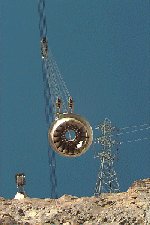 Photograph of powerplant equipment being lowered by the cableway.