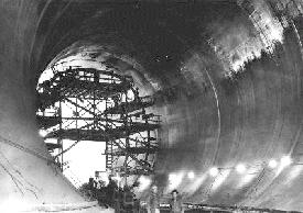 Photo of concrete-lined tunnel.