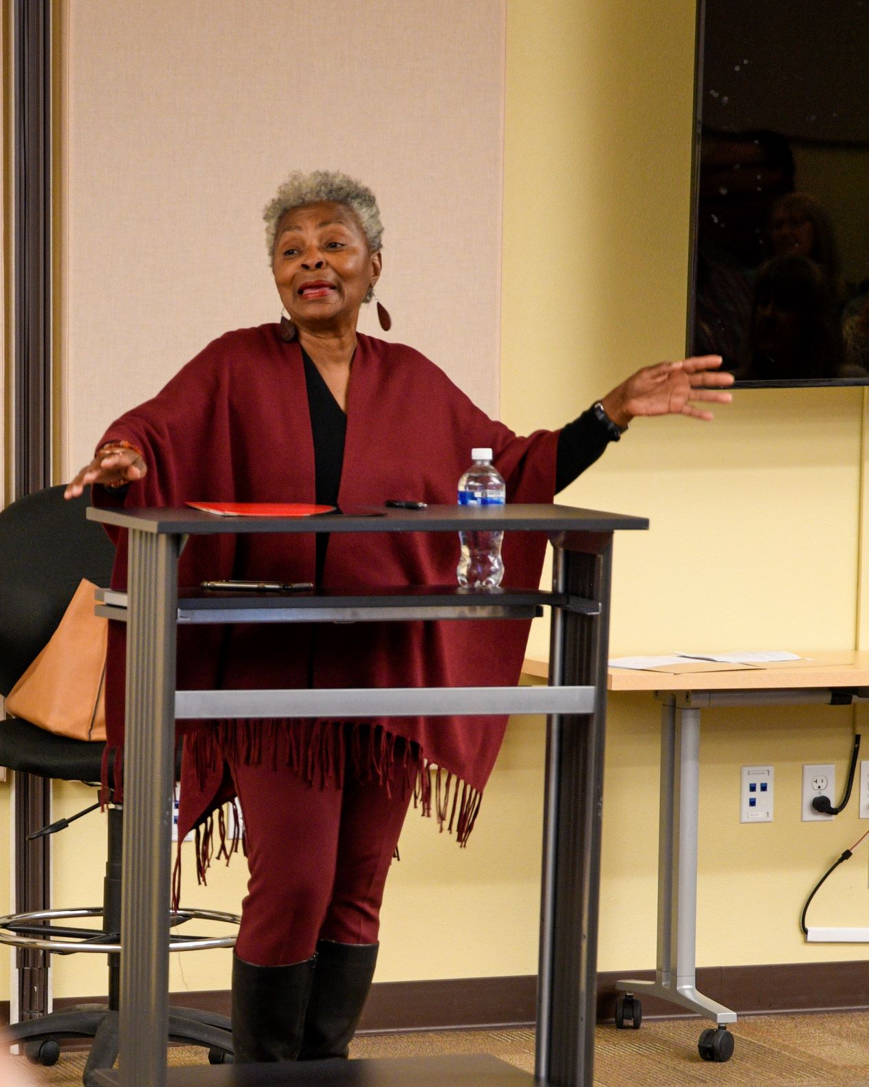 At the Women’s History Month celebration, Claytee chronicled the history of the women’s suffrage movement in the United States. Photograph by Daniella Grabish.