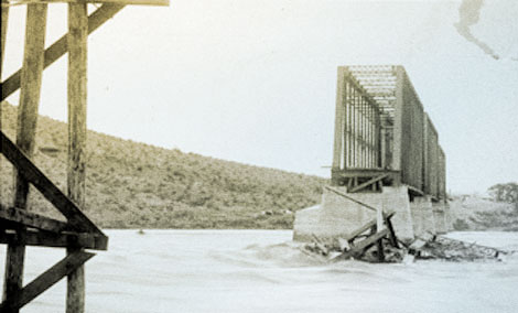 Flooding on the Salt River created havoc for farmers as well as the Santa Fe Railroad.  Floods damaged head gates, washed away diversion dams, and silted-in canals.  Scenes like this ultimately led to the request for Federal assistance to build a dam on the Salt. 1905. (U.S. Reclamation Service)