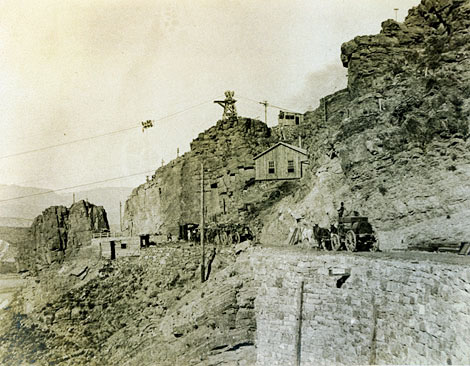 In this photograph, two freight wagons approach the construction site for the Roosevelt Dam, No date. (Courtesy of Salt River Project)