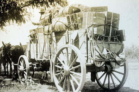Freight wagon with luggage and baggage belonging to Italian stone masons from Pennsylvania hired to work on construction of the dam, 1906. (Reclamation photograph)