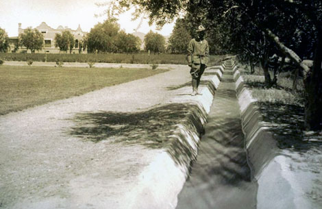 Improvements made to irrigation systems included lining laterals to conserve water, such as the cement-lined irrigation ditch on the Mallin Ranch about six miles north of Phoenix, 1910. (Reclamation photograph)