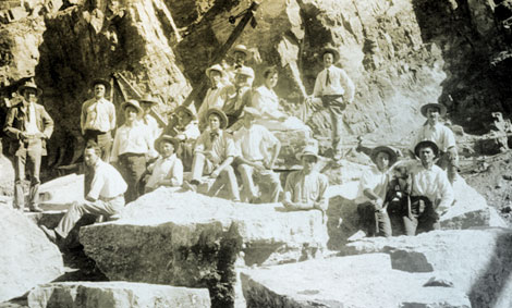 Roosevelt Dam was designed as a masonry dam that required each block of stone to be precisely cut and shaped.  Stonemasons from around the world were sought out and hired for the demanding job.  Masons of German, Scottish, Italian, and Swiss heritage worked on the dam. Here twenty-six Italian stonemasons from the East Coast pose for the Reclamation Service photographer Walter J. Lubken in 1906. (Reclamation photograph)