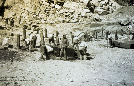 Workers from Arizona Territory—Black, Indian, Mexican, and Anglo—were joined by hundreds of other workers from numerous ethnic backgrounds from across the United States to work on Roosevelt Dam. Here they are pictured excavating the foundation for the dam, 1906. (Reclamation photograph)