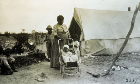 Like many Anglo workers, Apache families joined the men who worked on the dam. Apache families camped in segregated areas near the dam. (Reclamation photograph)