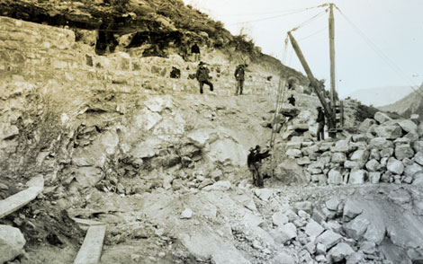 Cement was made at the dam site to save money by avoiding the cost of hauling it from Phoenix.  In this 1904 photograph, Lubken captures construction workers building the cement plant. (Reclamation photograph)
