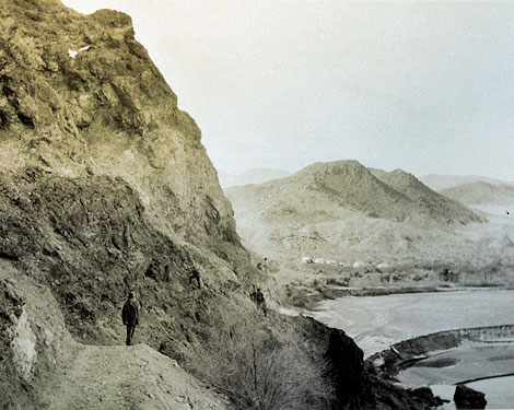 Black canyon dam site with beginnings of a construction camp in the background. (Reclamation photography)
