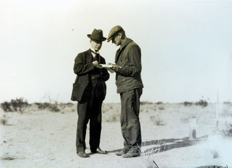 A farmer and the Project Manager close a deal on a farm plot on Yuma Mesa. No date. (Reclamation photograph)