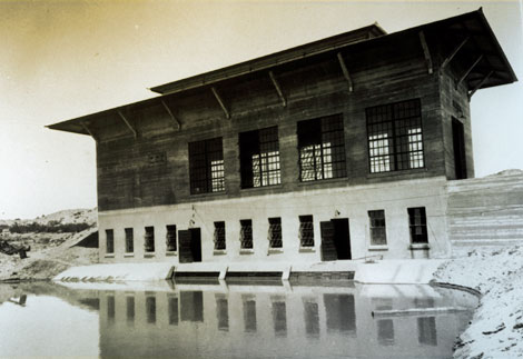 This 1922 photograph shows the forebay of the new power plant for the pump station constructed at the base of Yuma Mesa. (Reclamation photograph)