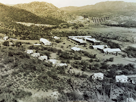 The photograph shows the construction camp where Reclamation staff and the contractor's work force lived.  Essentially a small town, the camp had a school, post office, infirmary, mess hall, barracks, married housing quarters, workshops, and offices. (Courtesy of Salt River Project)