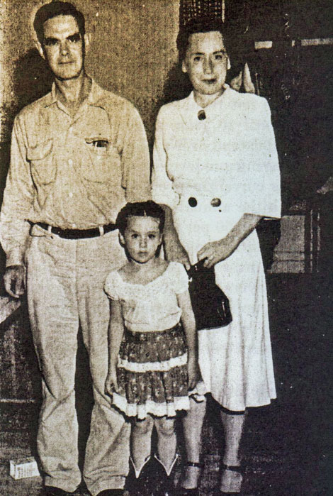 Yuma veteran Francis Henry Martin, his daughter, and Mrs. Martin were on hand to hear his name called on the 15th draw for a homestead. Photo by Samuel B. Watkins, Region III. From "The Reclamation Era", September 1948