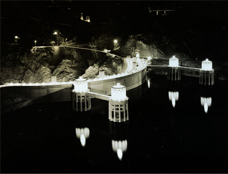 Hoover Dam with lighted intake towers, December 1940. Reclamation photo.