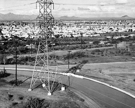 The same view of the Cross Cut Canal in 1968, showing the obvious and major encroachment of development. The increasing population portends the switch in primary water uses from agriculture to municipal and industrial use which was to come by the end of the 20th century. Reclamation ERA photo.