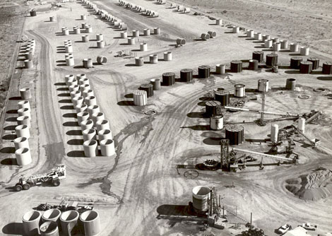 During construction of the Central Arizona Project, some areas required that the water be delivered via huge concrete pipe sections, known as siphons, that could travel beneath obstructions such as roads or riverbeds. The concrete pipe sections were cast and stored as close to their eventual placement as possible.