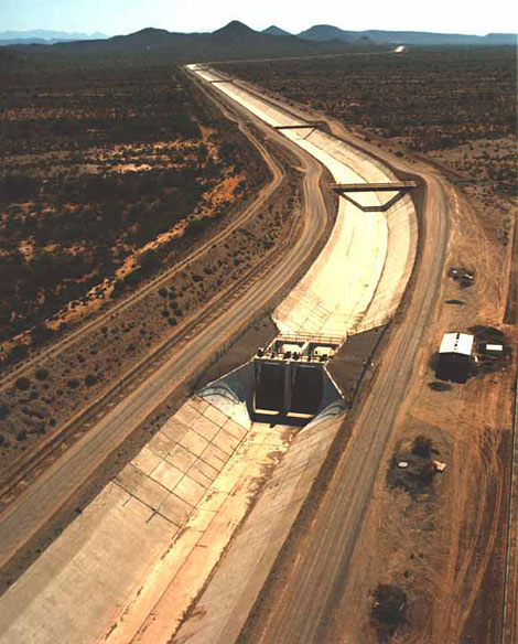 Construction of the Central Arizona Project canal, showing a turn-out structure.