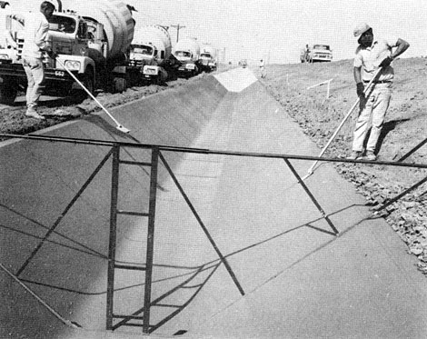 Roosevelt Water Conservation District Canal being lined with concrete. The canal was transformed by men and machines. Arizona Farmer-Ranchman, September 1969.