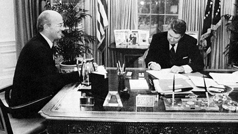 Secretary of Interior James Watt watches as President Reagan signs the Reclamation Reform Act of 1982 into law. (Photo by Mary Anne Feckelman, The White House). Photo from The Reclamation Era, 1980. (Reclamation photograph)
