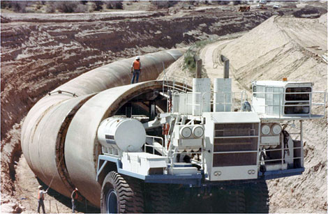 Machine used to move pipe sections which were cast on site and then moved to the crane to be placed in the excavation. Pipe sections were 21-feet inside diameter, 22-feet long, and weighed 225 tons each. (Reclamation photograph)