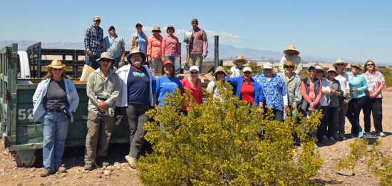 The Lower Colorado Region Resources Management Group take a break from the cleanup to pose for a group photo.