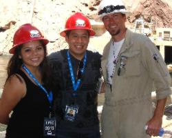 Two members of the group pose with their escort Brandon Sparks, right.
