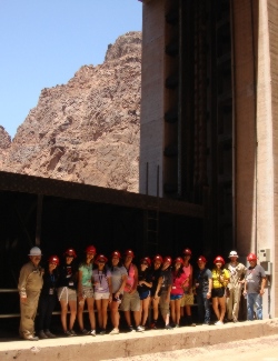 This group posed with their escorts Ruben Martinez, left, and Brandon Sparks, second from right, at the Arizona Stoney Gate.