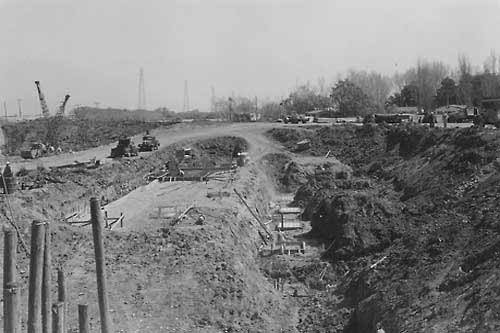 Construction excavation for secondary louvers at the Tracy Fish Collection Facility during March 1956