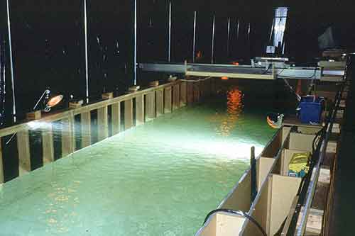 Research flume with cover to simulate darkness in the Hydraulics Research Laboratory at the Bureau of Reclamation's Technical Service Center, Denver, Colorado.