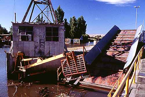 photograph: View of the debris removal crane on the south side of the intake channel near the trash rack at the Tracy Fish Collection Facility, Tracy, California