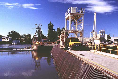 photograph: Looking south at the trash rack on the intake channel of the Tracy Fish Collection Facility, Tracy, California. Reclamation photo by Doug Craft
