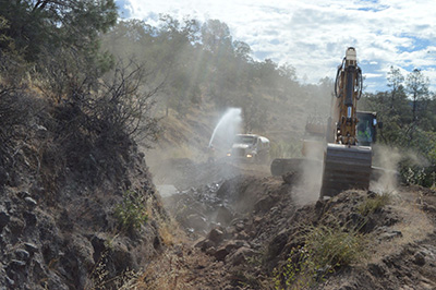 Crew preparing to backfill the canal, looking upstream