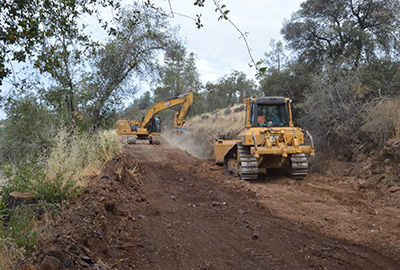 Crew backfilling the canal, looking downstream