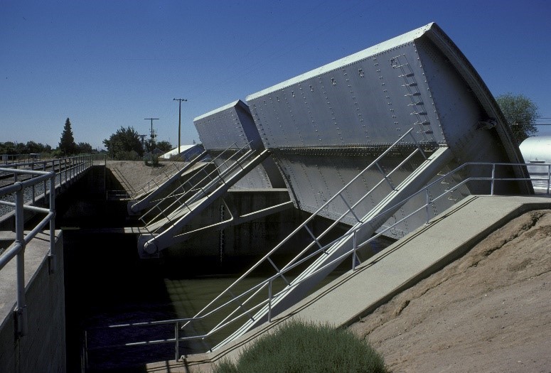 Two radial gates, each 60 x 30 feet and weighing a total of 243 tons, open to allow water to flow down the channel, or close to prevent drawing endangered fish species into the interior Delta. 