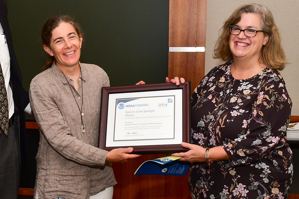 Randi Field (left) accepts National Marine Fisheries Service award in Sacramento Aug. 30, 2019. (USBR photos/Todd Plain) 